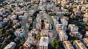 Aerial view from the sea over the city of Genoa, Italy. Suspended highway and infrastructure