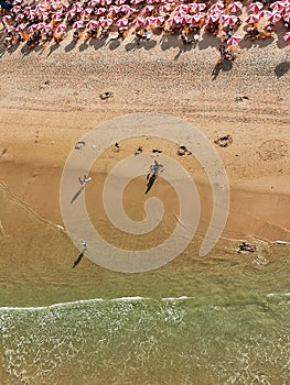 Aerial View of the sea and people in the sand at Praia do Futuro Beach, Fortaleza, CearÃÂ¡ Brazil photo