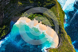 Aerial view at sea and rocks. Natural landscape. Kelingking beach. Nusa Penida. Bali. Indonesia. Blue water background from top vi photo