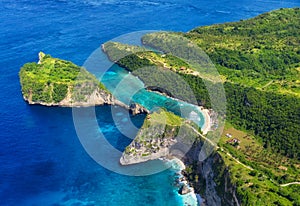 Aerial view at sea and rocks. Turquoise water background from top view. Summer seascape from air. Atuh beach, Nusa Penida, Bali, I