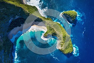 Aerial view at sea and rocks. Turquoise water background from top view. Summer seascape from air. Kelingking beach, Nusa Penida, B photo