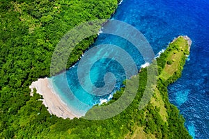 Aerial view at sea and rocks. Turquoise water background from top view. Summer seascape from air. Atuh beach, Nusa Penida, Bali, I