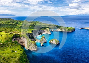 Aerial view at sea and rocks. Turquoise water background from top view. Summer seascape from air. Atuh beach, Nusa Penida, Bali, I