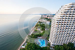 Aerial view of sea shore, sand beach and cityscape of modern city in Hua Hin, top tourist attractions in Thailand. Summer season