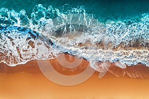 Aerial view of sea waves and sandy beach photo