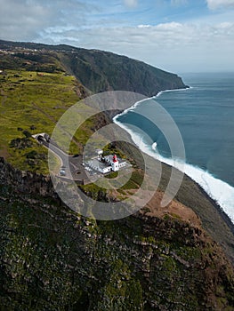 Aerial view of sea waves washing rocky beach in Ponta do Rosto photo