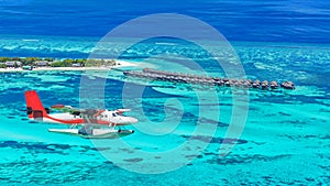 Aerial view of a seaplane approaching island in the Maldives