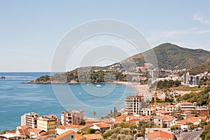 Aerial view on seascape of Adriatic sea coast in Budva Riviera. Location place Becici opposite the island of St