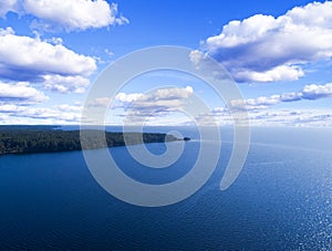 Aerial view of seashore with beach, lagoons and coral reefs. Coastline with sand and water. Tropical landscape. Aerial photography