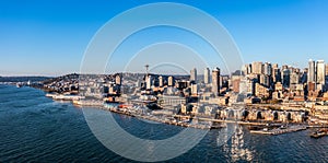 aerial view of Seattle Downtown and the Waterfront pier area with the cruise ship terminal and the Space Needle Tower