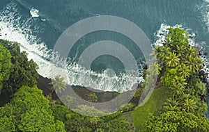 Aerial View Of A Secluded Black Sand Beach In Hawaii