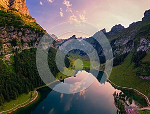 Aerial view of the Seealpsee lake in the Swiss Alps at sunset