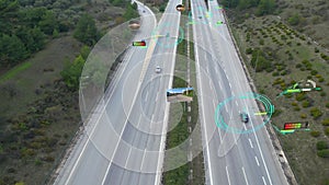 Aerial view of self driving autonomous cars with hud elements on city highway. Futuristic intelligent traffic detection