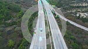 Aerial view of Self Driving Autonomous Cars with HUD Elements on City Highway. Futuristic Intelligent Traffic Detection