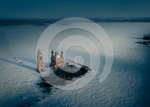 Aerial view of a semi-destroyed abandoned church in the dark winter in the Yaroslav region, Russia