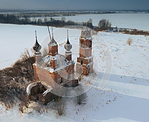 Aerial view of a semi-destroyed abandoned church in the Yaroslav region in winter, Russia