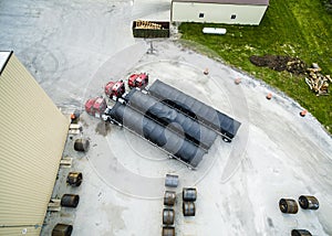 Aerial view of Semi tractor trailers parked with steel coils