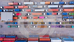 Aerial view of semi truck and trailer loading at logistic center, Business freight shipping import export transportation by semi