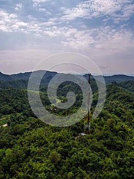 Aerial view of the serene Gua Musang Kelantan, featuring lush forest, and the Jerek Baru Village