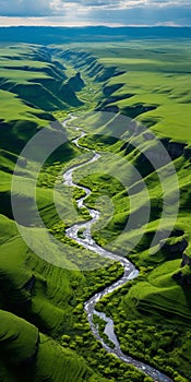 Tranquil Aerial View Of Green River Flowing Through Vibrant Field