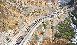 Aerial view of several railway wagon trains with goods at the railway station, Aerial view. Matucana - Peru