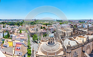 Aerial view of Sevilla from la giralda tower with Real Alcazar and Plaza de Espana, Spain