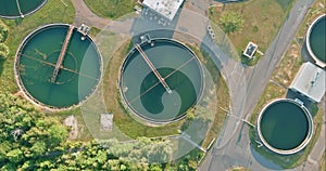 An aerial view of the sewage treatment facilities at a modern wastewater treatment plant showing aeration water