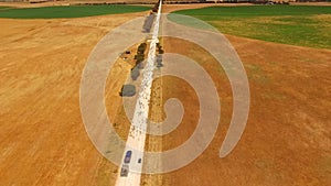 Aerial view of sheep on outback road.