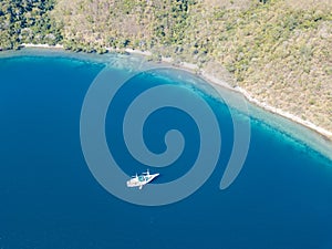 Aerial View of Ship and Fringing Coral Reef