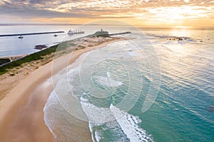 Nobbys Beach and Newcastle Harbour Ship leaving port - aerial view photo