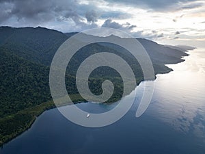 Aerial View of Ship and Scenic Coast of Island in Raja Ampat