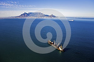 Aerial view of ship in Table Bay with Table Mountain photo