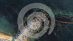 Aerial view of the ship washed ashore. Shot. Top view of an abandoned old and rusty shipwreck on a stormy day