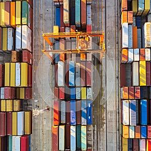 Aerial view of shipping container port terminal. Colourful pattern of containers in harbor. Maritime logistics global