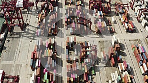 Aerial view of shipping containers with transport network trucks Kwai Tsing Container Terminals, Hong Kong.