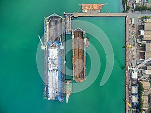 Aerial view shipyard have crane machine and container ship in gr