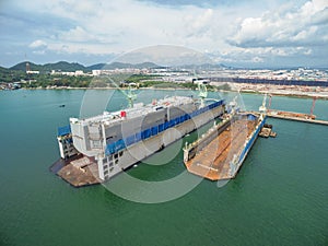 Aerial view shipyard have crane machine and container ship in gr