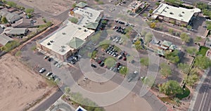 Aerial view shopping district center and parking lot in Avondale small town panorama view of a freeway interchange the