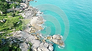 Aerial view of shore rocks and sea waves