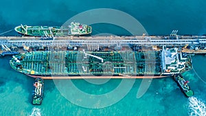 Aerial view shot of crude oil tanker ship anchored at the oil te photo