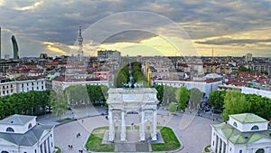 Aerial view shot of flying drone Milano italian city in Lombardia round square Arco della pace central historical arch