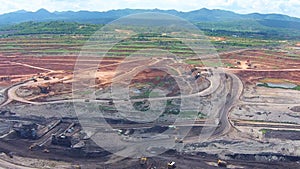 Aerial view shot for Mining dump trucks working in Lignite coalmine lampang thailand