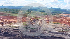 Aerial view shot for Mining dump trucks working in Lignite coalmine lampang thailand