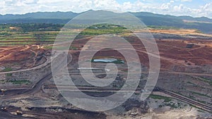 Aerial view shot for Mining dump trucks working in Lignite coalmine lampang thailand