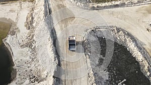 Aerial view shot, open pit mine, dumpers, quarrying extractive industry, stripping work