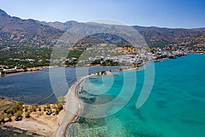Aerial view showing the causeway connecting Elounda to Kolokitha island along with the remains of the Minoan city of Olous