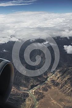 Aerial view of the Shyok river and high mountain from the airplane window. New Delhi-Leh flight ,India.