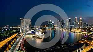 Aerial view of Singapore business district and city at night in
