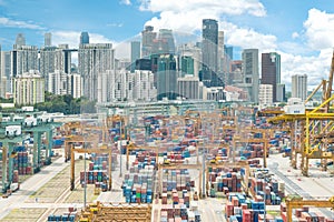 Aerial view of Singapore cargo container port and Singapore city