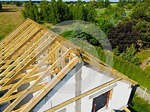 Aerial view on single family house finished roof wooden construction